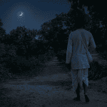 Devotees walking along the sacred path of Govardhan Parikrama